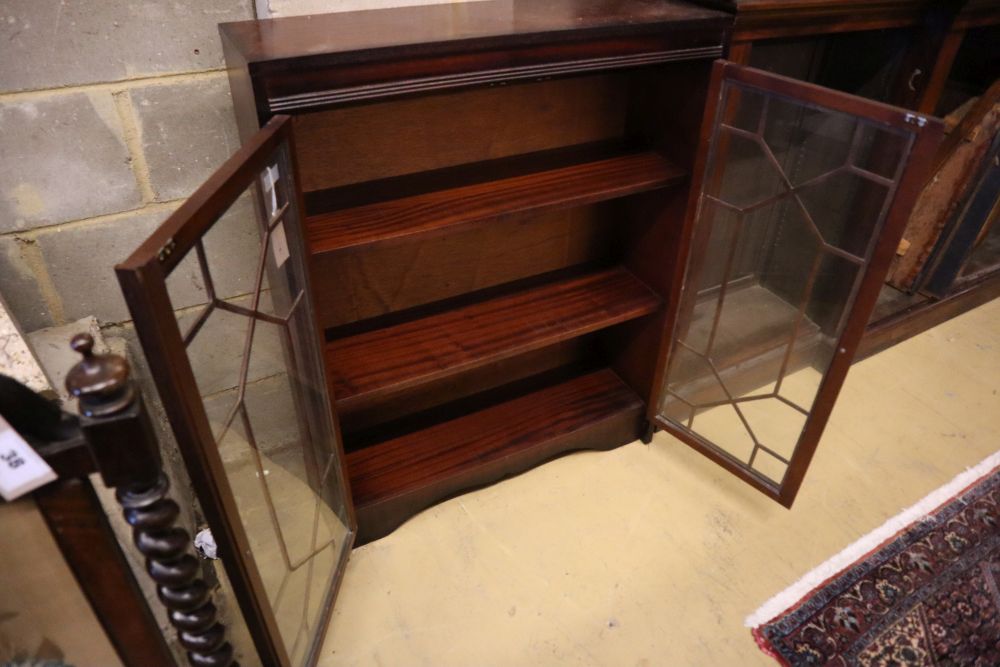 A reproduction mahogany bookcase, with astragal glazed doors, width 81cm, depth 25cm, height 102cm